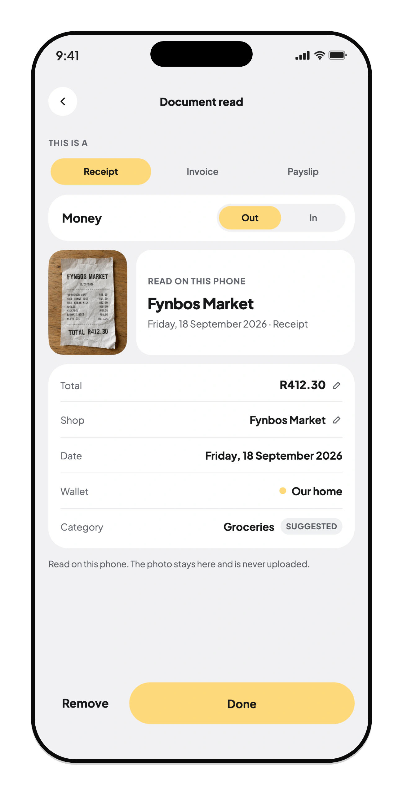 A slip read on the phone: total, shop, date, wallet and category